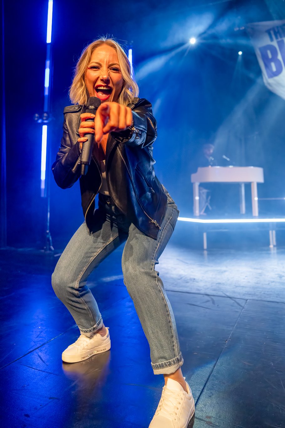 Big Pants Party singer in a leather jacket pointing at the audience